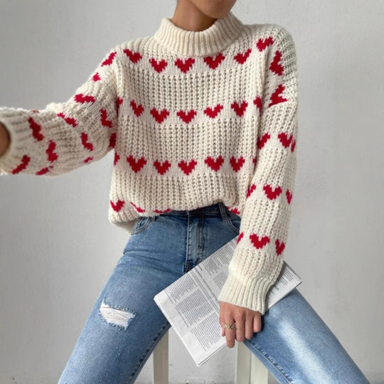 Damen nan Grobstrickpullover mit eingestrickten Herzmotiven, hohem Stehkragen und lässiger Oversize-Silhouette Shop Nory