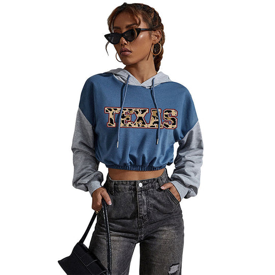 Damen Kurzgeschnittener Kapuzenpullover mit Teddy‑Print, Colorblock‑Ärmeln und elastischem Saum Shop Nory