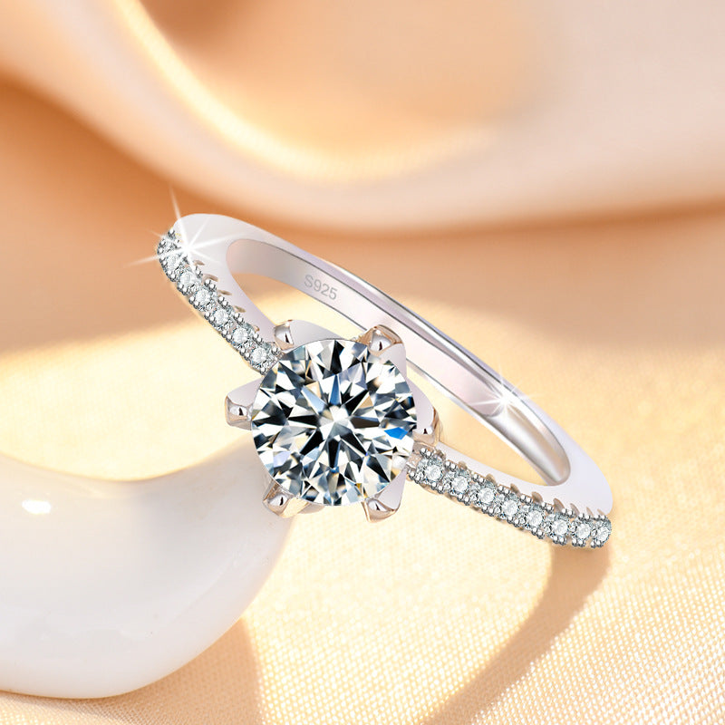 Damenring mit funkelndem Zirkonia und eleganten Goldverzierungen Shop Nory