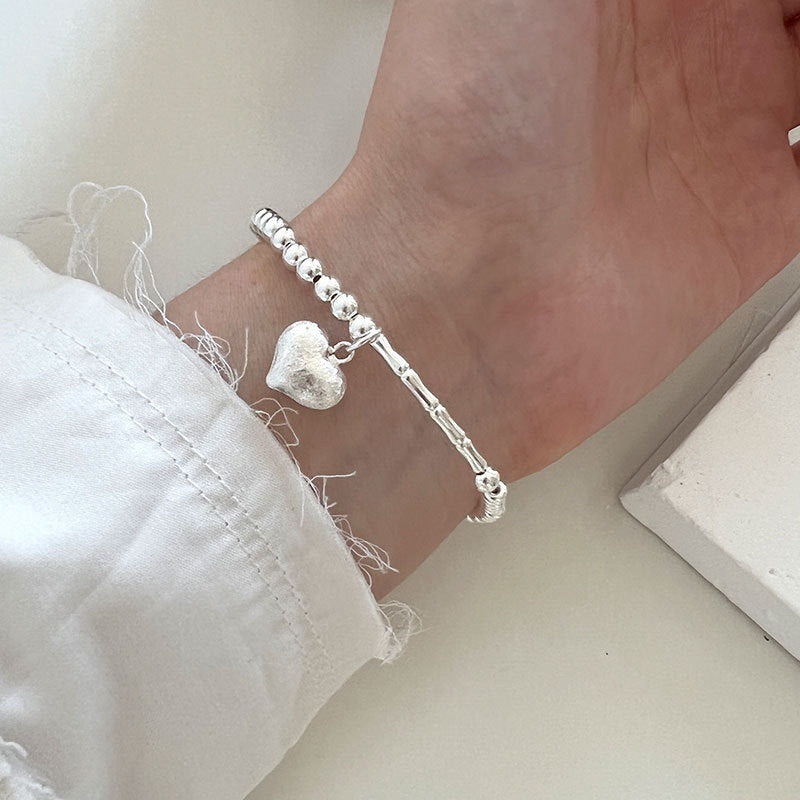 Damen Armband mit herzförmigem Anhänger Shop Nory