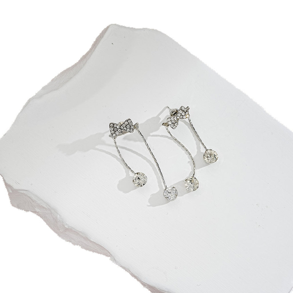 Damen Ohrringe mit funkelndem Schleifen-Design und elegantem Tropfenanhänger Shop Nory