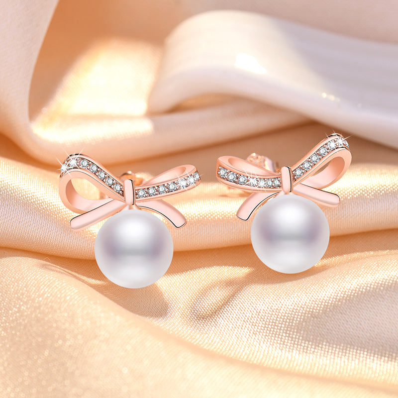Damen Ohrringe mit Perlendesign und funkelnden Zirkonia Shop Nory