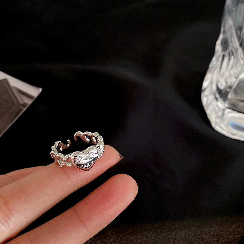Damenring mit geschwungenem Herzen und funkelnden Details Shop Nory