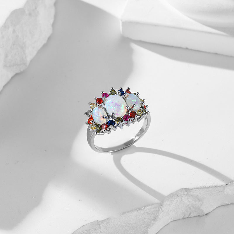 Damen eleganter Ring mit opalisierten Steinen und bunten Akzenten Shop Nory