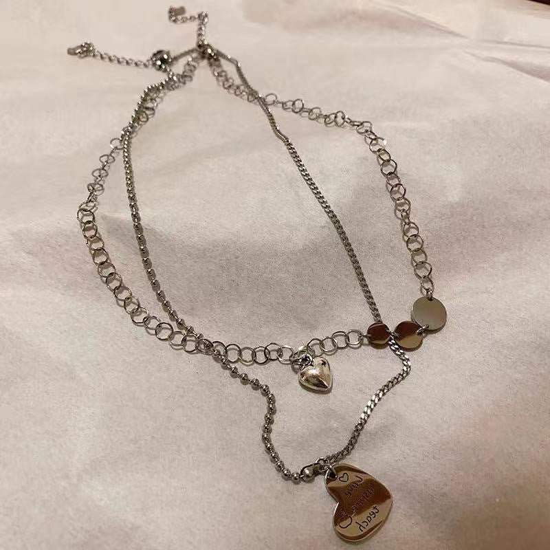 Damen Kette mit harmonischem Layering-Design und verspielten Anhängern Shop Nory