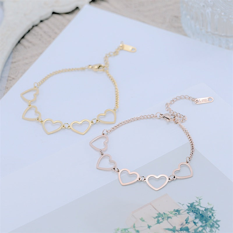 Damen Herzarmband mit eleganten, filigranen Anhängern Shop Nory
