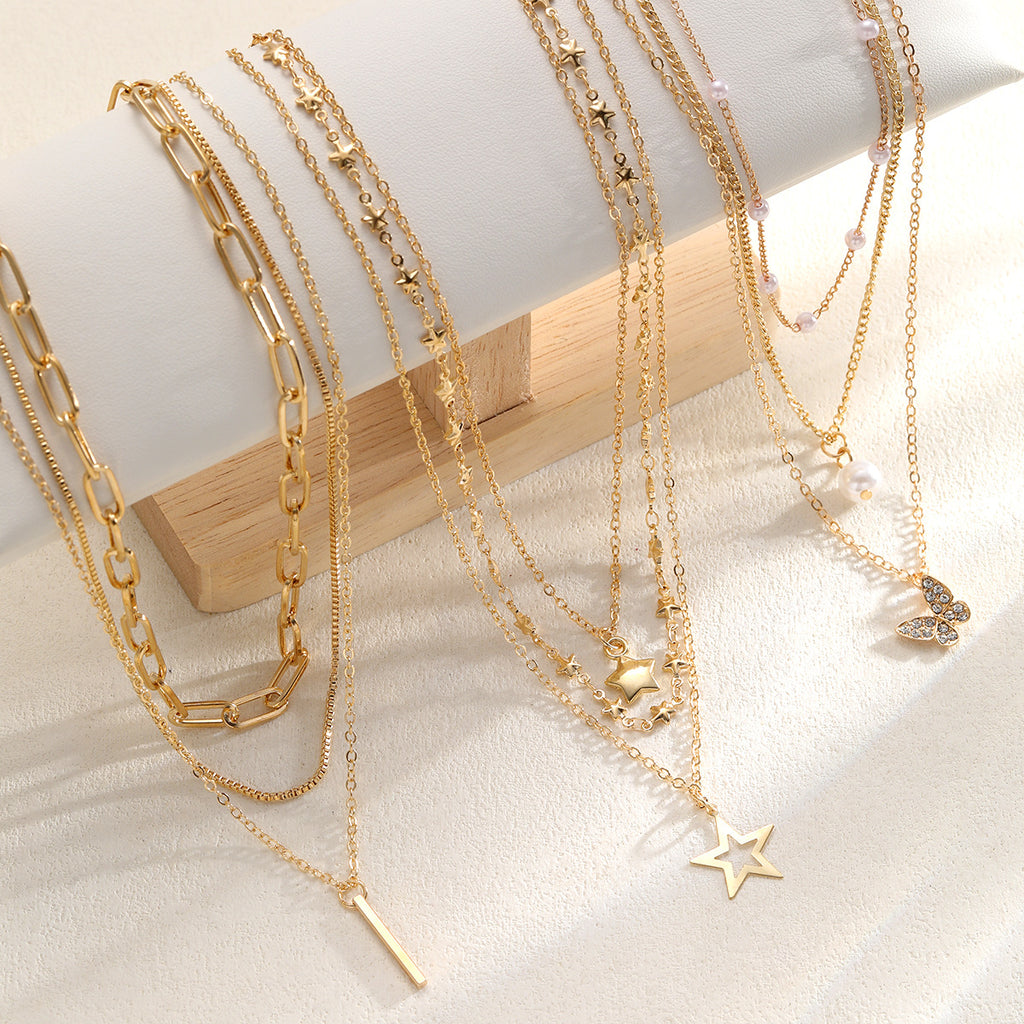 Damen mehrlagige Halskette mit zarten Anhängern und funkelnden Details Shop Nory