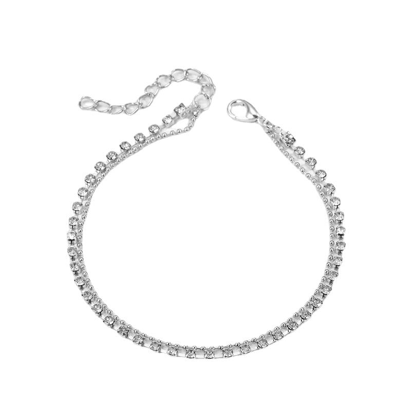Damen Fußkettchen mit funkelnden Zirkonia und eleganter Gold-Oberfläche Shop Nory