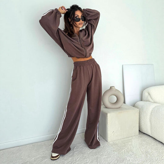 Damen cropped Zip-Hoodie mit voluminösen Ballonärmeln und High-Waist Relaxhose im sportlichen Seitenstreifen-Design Shop Nory