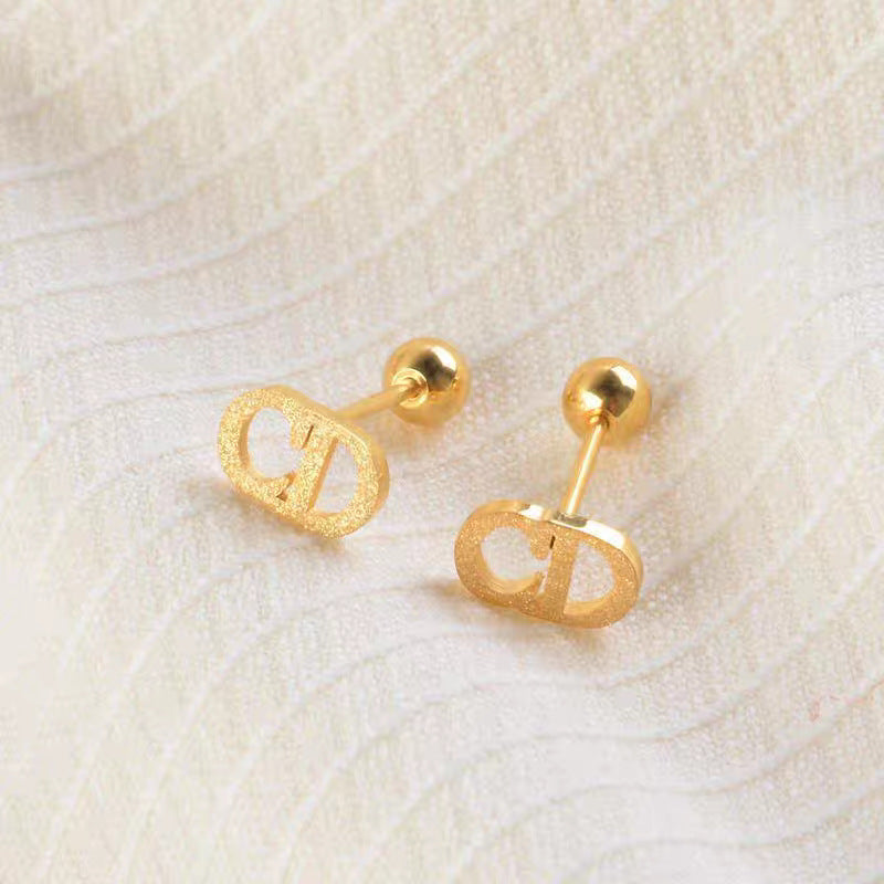 Damen elegante goldene Logo Steckerohrringe Shop Nory