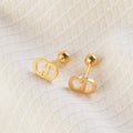 Damen elegante goldene Logo Steckerohrringe Shop Nory