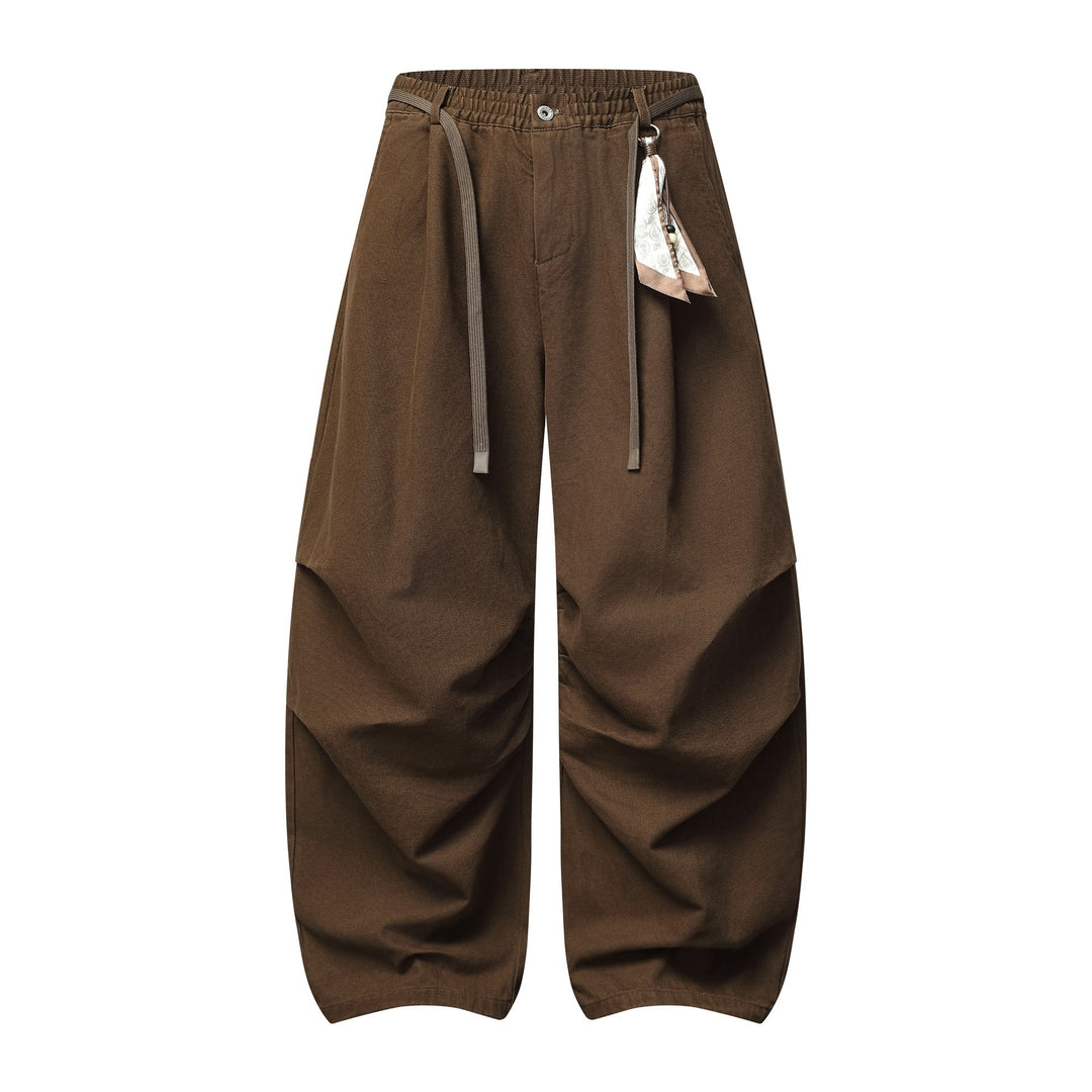 Damen Weite Culotte‑Hose mit Elastikbund, Stufenfalten und dekorativem Tuchanhänger Shop Nory