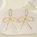 Damen Statement Ohrringe mit einzigartigem Schleifen-Design Shop Nory