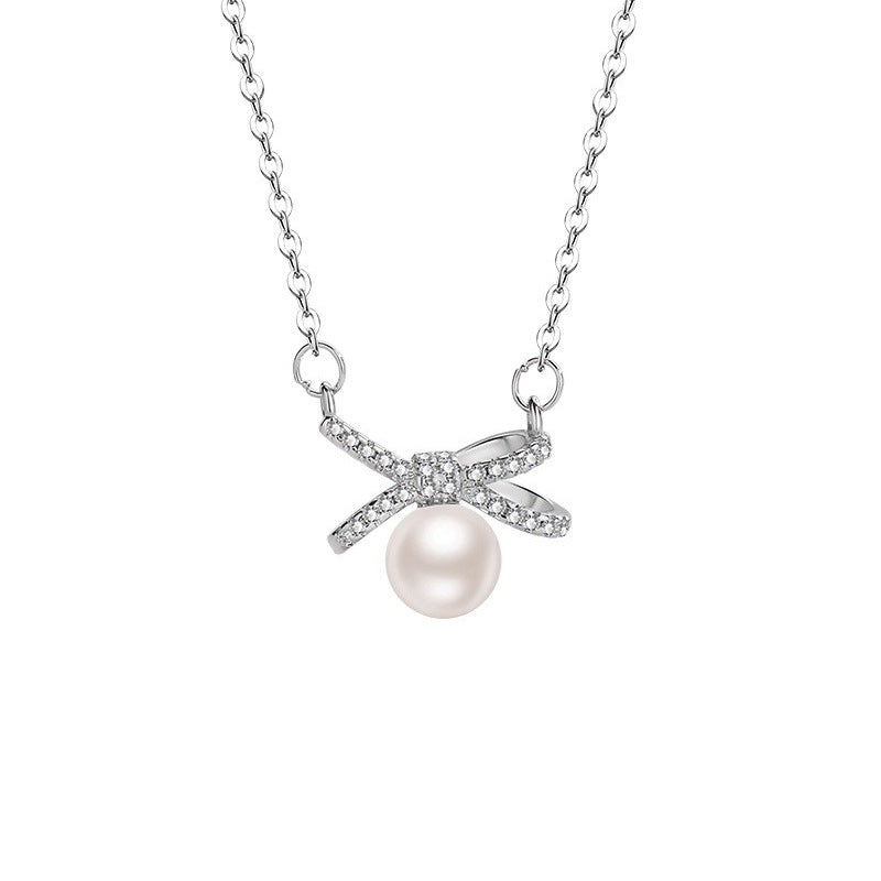Damen Halskette mit elegantem Schleifenanhänger und luxuriöser Perle Shop Nory