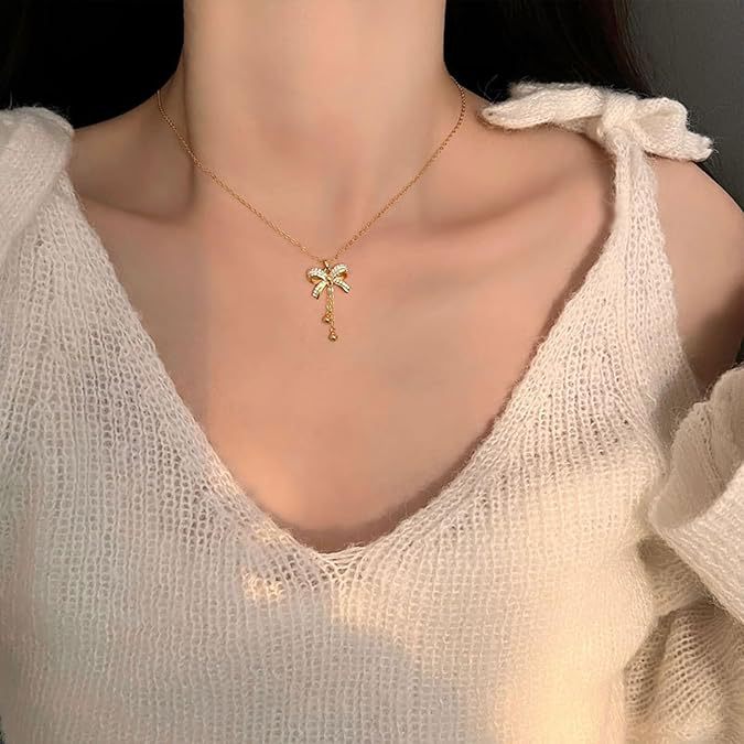 Damen Halskette mit eleganter Schleifenapplikation und funkelnden Details Shop Nory