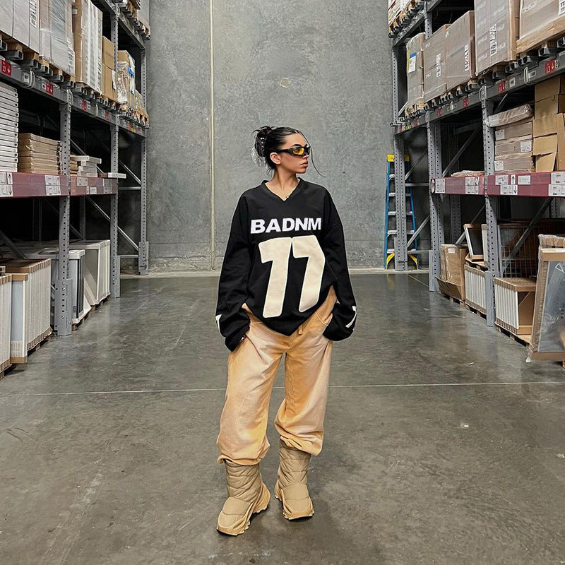 Damen Oversize Sport-Sweatshirt mit V-Ausschnitt und Statement-Print Shop Nory