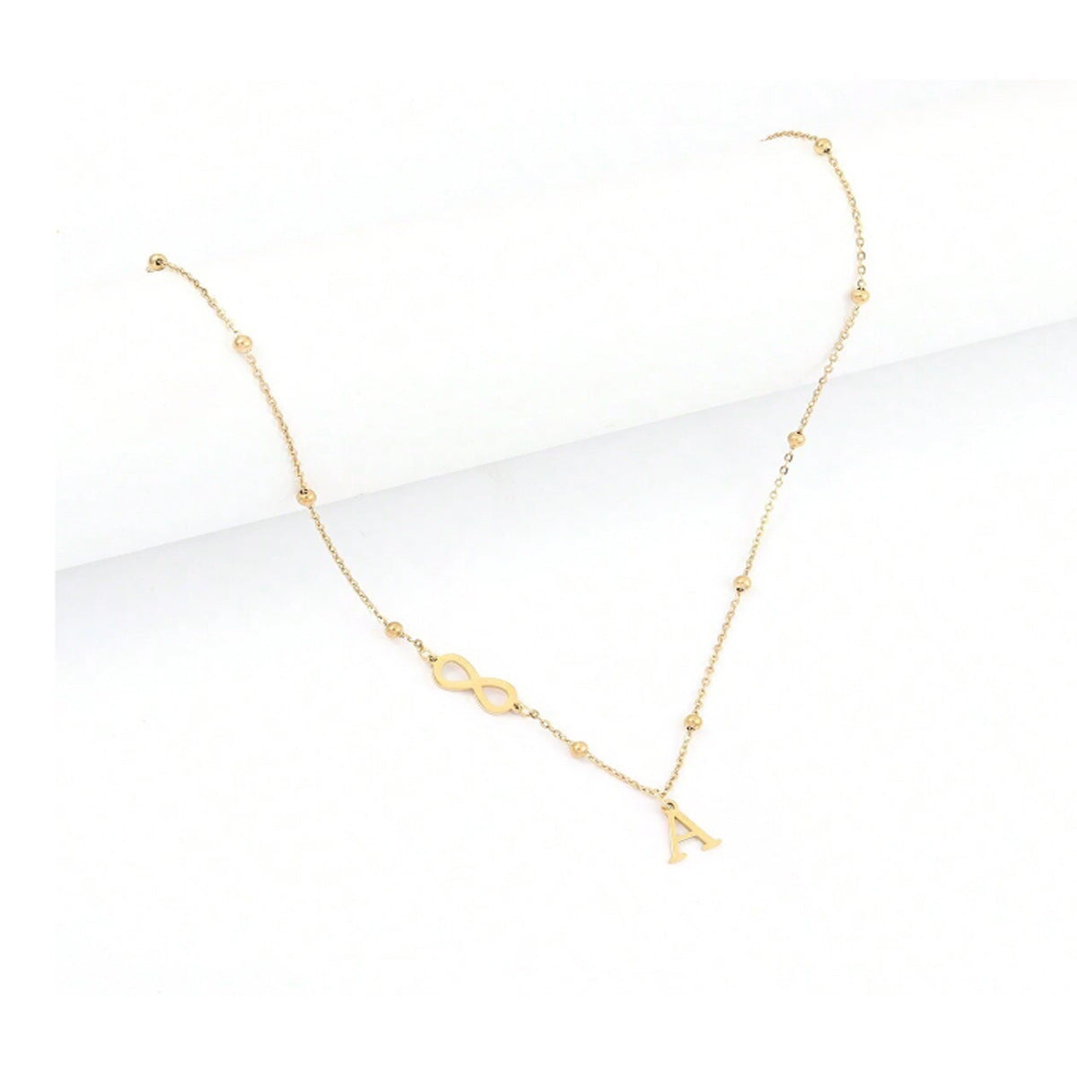 Damen personalisierte Infinity-Halskette mit Initial-Anhänger und glänzendem Design Shop Nory