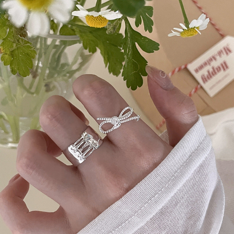 Damen Ohrstecker mit kunstvollem Schleifen-Design und funkelndem Zirkonia Shop Nory