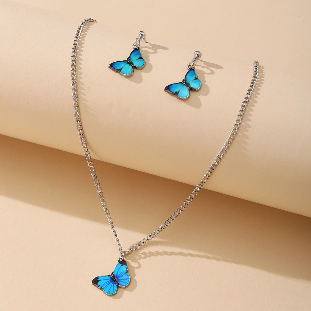 Damen Schmuckset mit schimmernden Schmetterlingsanhängern und funkelnden Elementen Shop Nory