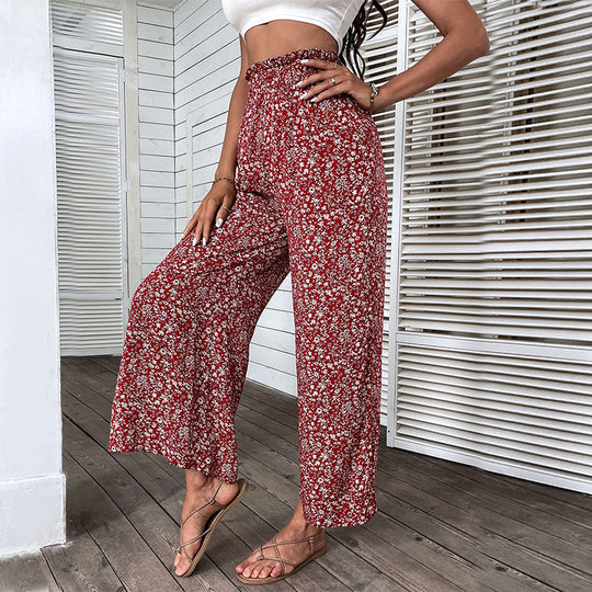 Damen Weite hochgeschnittene Palazzo‑Hose mit floralem Muster und seitlichem Beinschlitz Shop Nory
