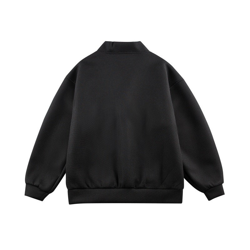 Unisex Boxy-Strickjacke im Waffelstrick mit V-Kragen, durchgehender Knopfleiste und aufgesetzten Rundtaschen Shop Nory