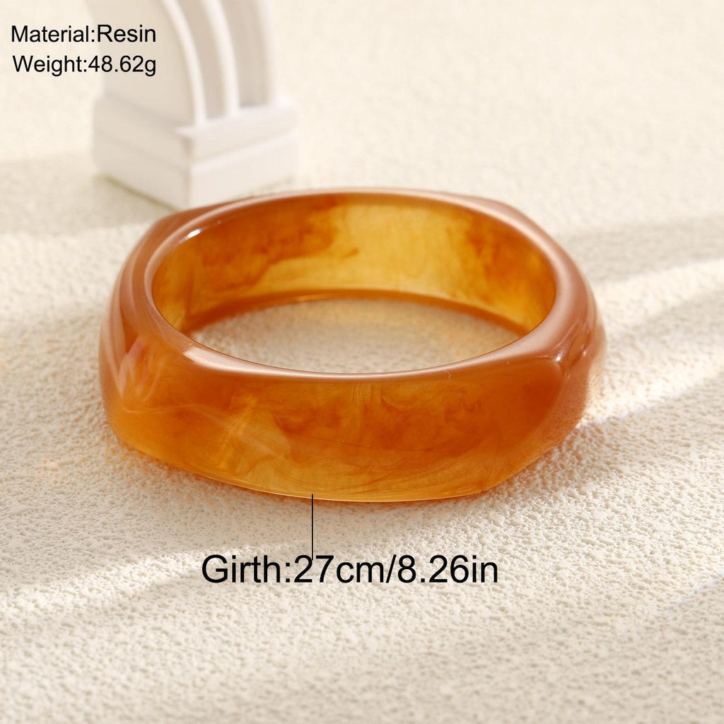 Damenarmreif aus hochwertigem Acryl mit eleganter, geschwungener Form Shop Nory