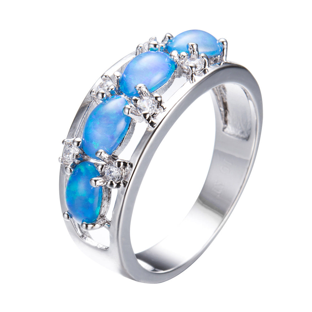 Damen Ring mit leuchtenden Opalsteinen und funkelnden Zirkonia-Elementen Shop Nory