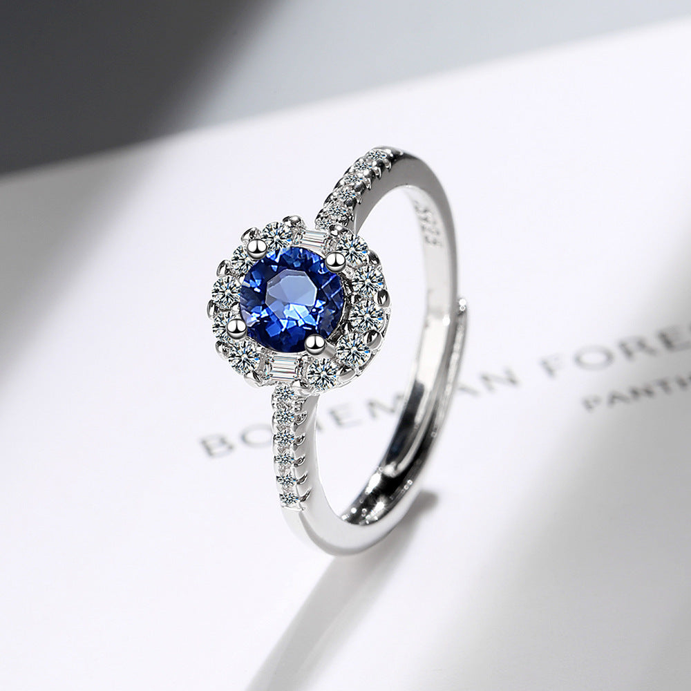Damen Funkelnder Cocktailring mit blauen Zirkonia und detailreicher Fassung Shop Nory