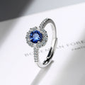 Damen Funkelnder Cocktailring mit blauen Zirkonia und detailreicher Fassung Shop Nory