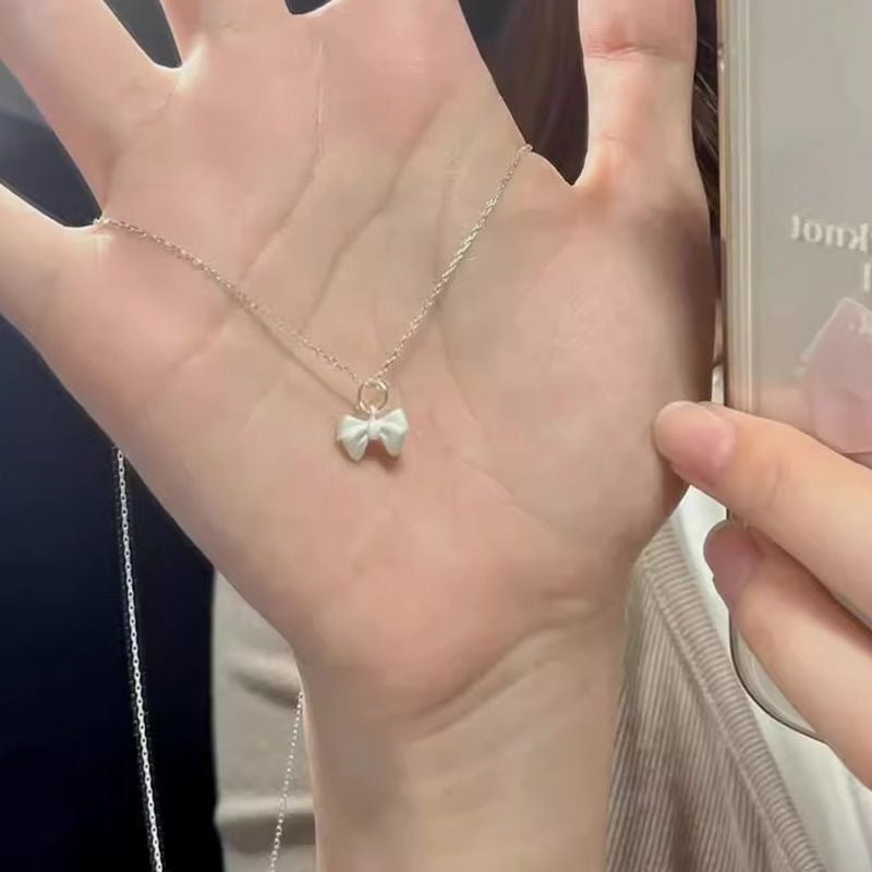 Damen Halskette mit filigranem Schleifenanhänger Shop Nory