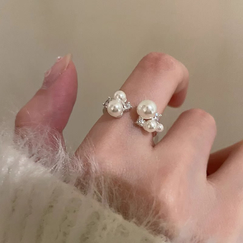 Damenring mit eleganten Perlen und funkelnden Zirkonia-Details Shop Nory