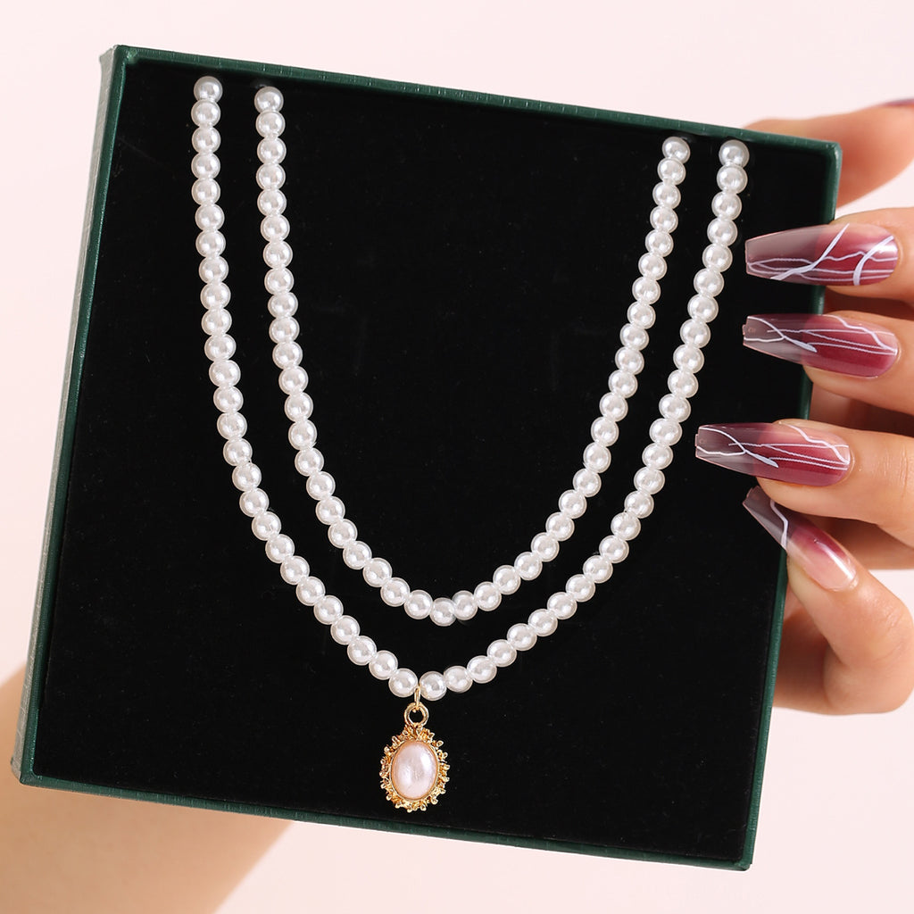 Damen Halskette mit doppelter Perlenreihe und eleganten Anhänger Shop Nory