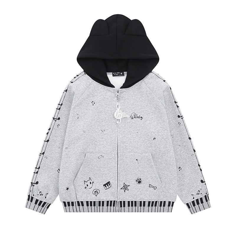 Damen Kapuzensweatjacke mit durchgehendem Reißverschluss, Musikprint, Klaviertasten‑Bündchen und Ohrenkapuze Shop Nory