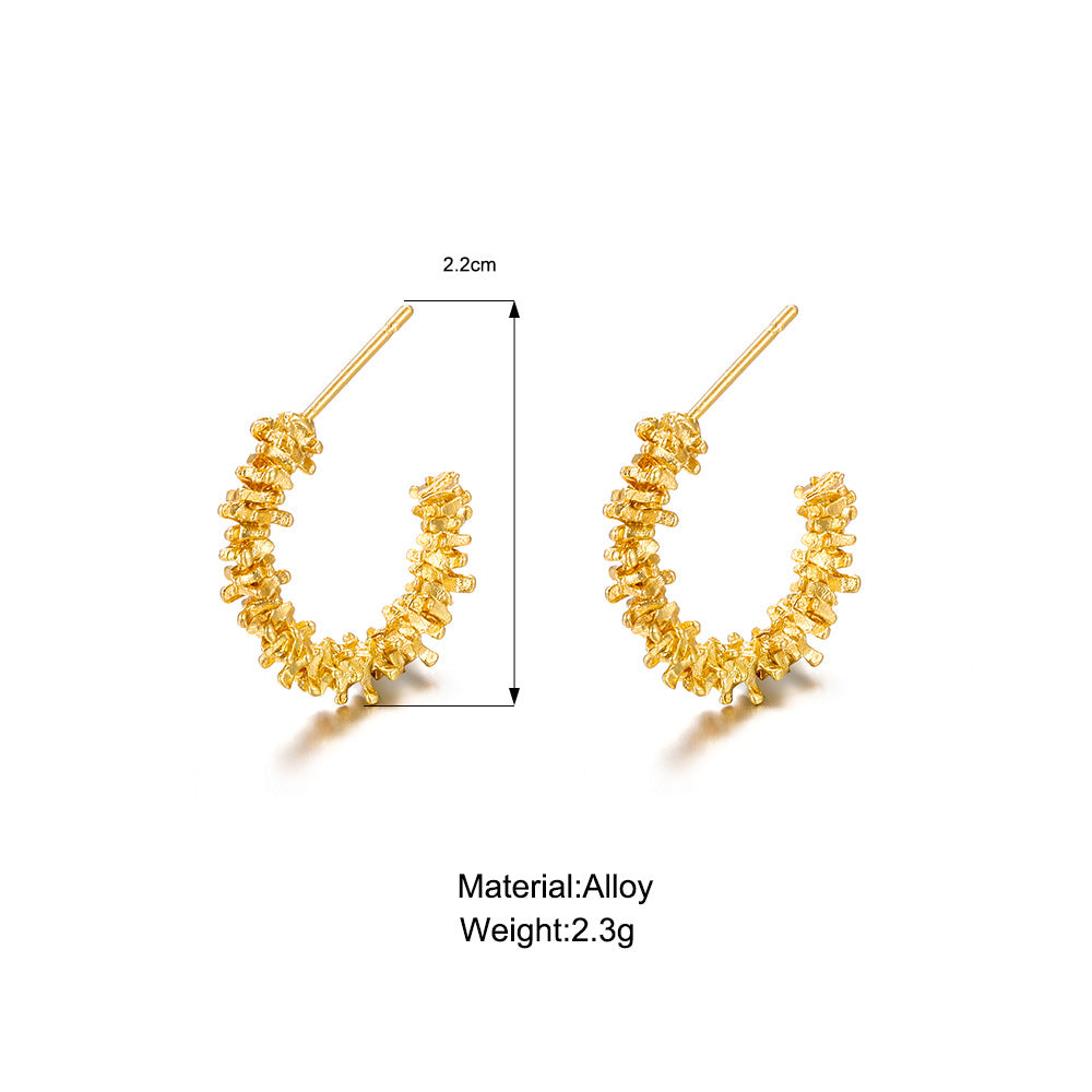Damenohrringe mit strukturiertem Design und glänzender Oberfläche Shop Nory