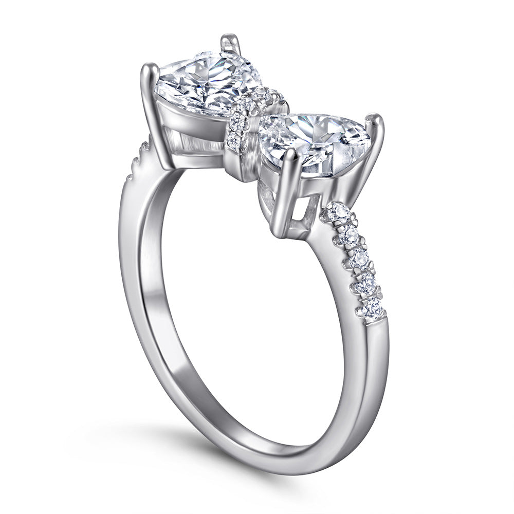 Damen Designer-Ring mit Schleifenmotiv und funkelnden Zirkonia Shop Nory