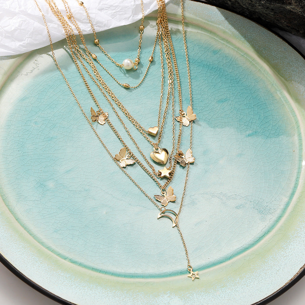 Damen Schmuckset mit mehrlagigen Ketten und vielfältigen Ringen Shop Nory