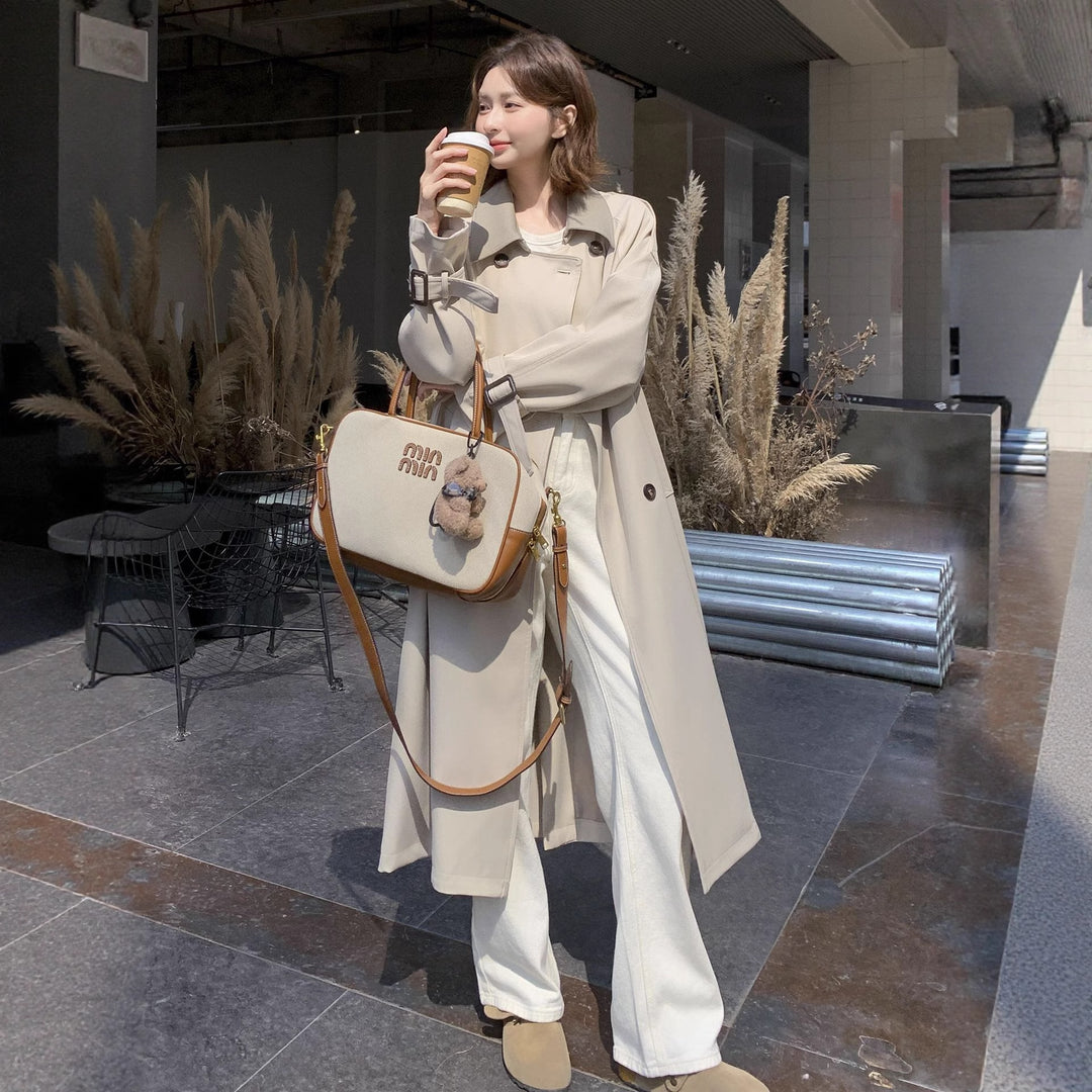 Damen Lang geschnittener minimalistischer Trenchcoat mit weichem Fall, überschnittenen Schultern und verstellbaren Ärmelriemen Shop Nory