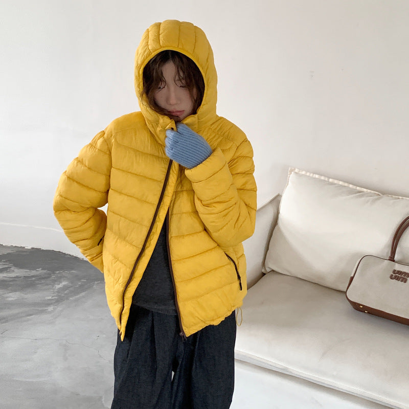Damen ultraleichte Pufferjacke mit abnehmbarer Kapuze und elastischem Saum