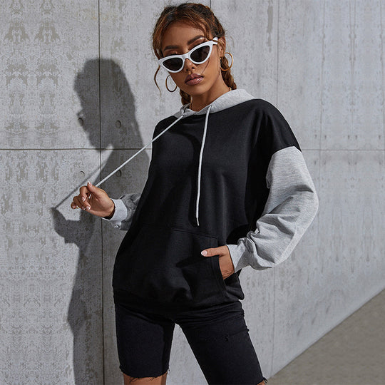 Damen Oversize Sweatshirt mit Kapuze, Kontrastärmeln und Kängurutasche Shop Nory
