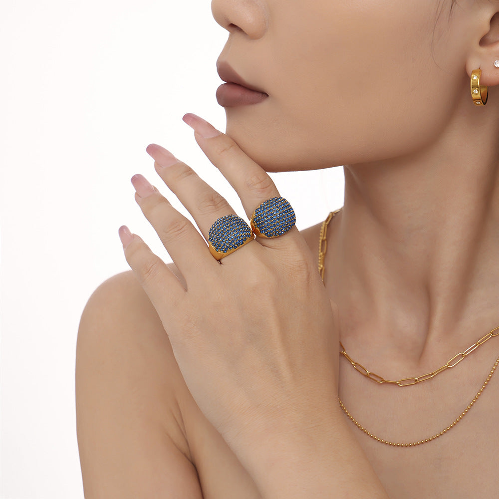 Damenring mit elegantem, goldbeschichtetem Design und Türkissteinbesatz Shop Nory