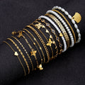 Damen Armband-Set mit filigranen goldenen Designs und charmanten Anhängern Shop Nory