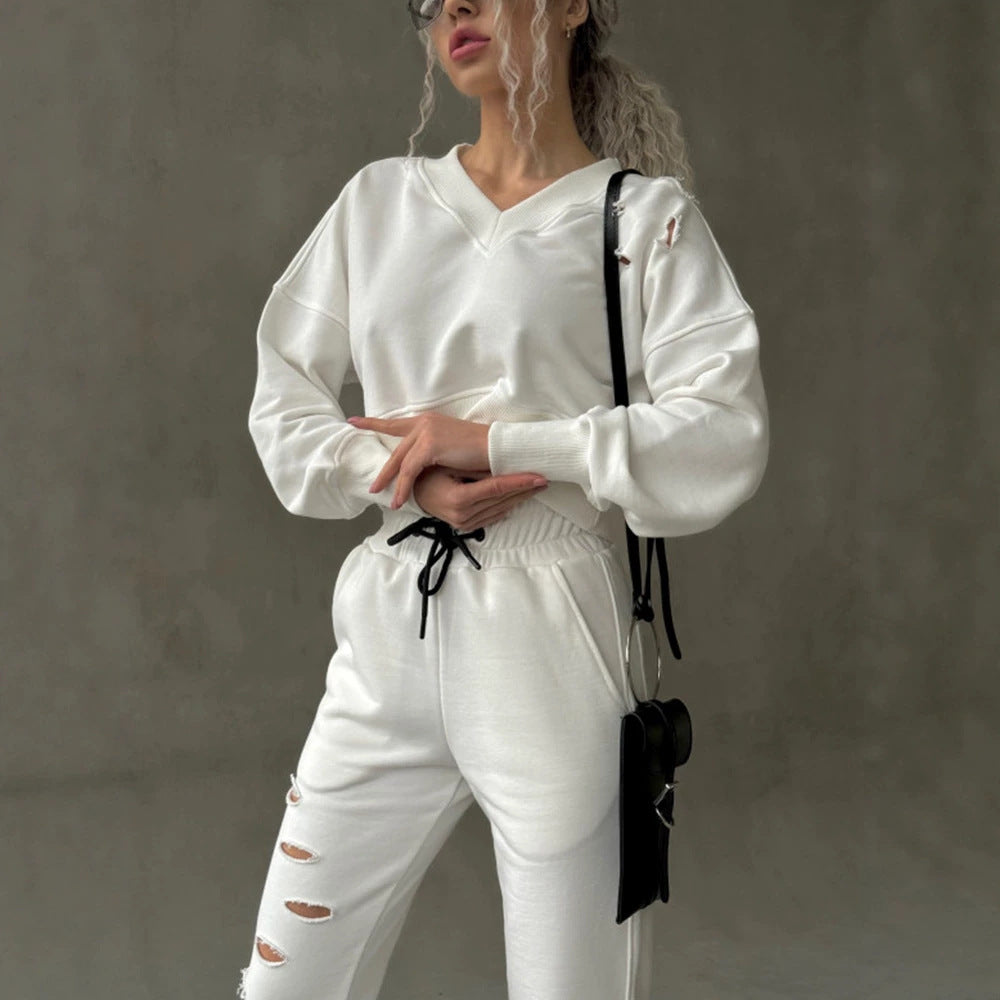 Damen kurzgeschnittenes Sweat-Set mit V-Ausschnitt, Rüschenbund Highwaist Jogginghose und Distressed-Details Shop Nory