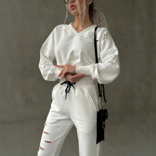 Damen kurzgeschnittenes Sweat-Set mit V-Ausschnitt, Rüschenbund Highwaist Jogginghose und Distressed-Details Shop Nory