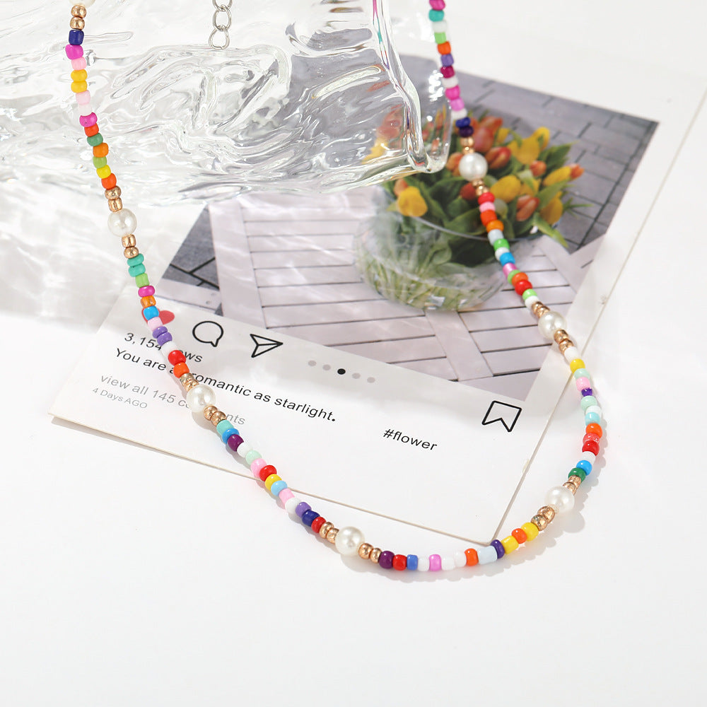 Damen Halskette mit bunten Blumenelementen und eleganten Perlen Shop Nory