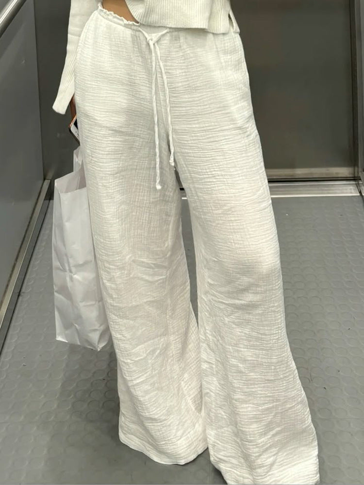 Damen Leinenhose mit lockerer, knöchellanger Passform, seitlichen Eingrifftaschen und Zierknopf-Details Shop Nory