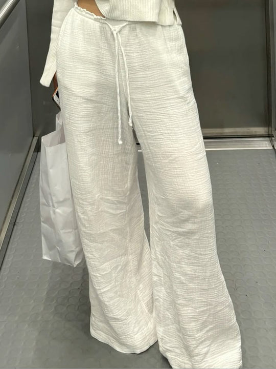 Damen Leinenhose mit lockerer, knöchellanger Passform, seitlichen Eingrifftaschen und Zierknopf-Details Shop Nory