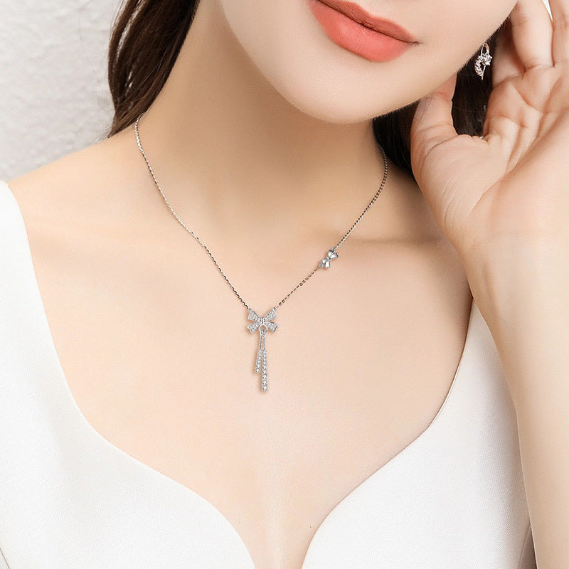 Damen Halskette mit kunstvollem Schleifenmotiv und funkelnden Zirkonia-Details Shop Nory
