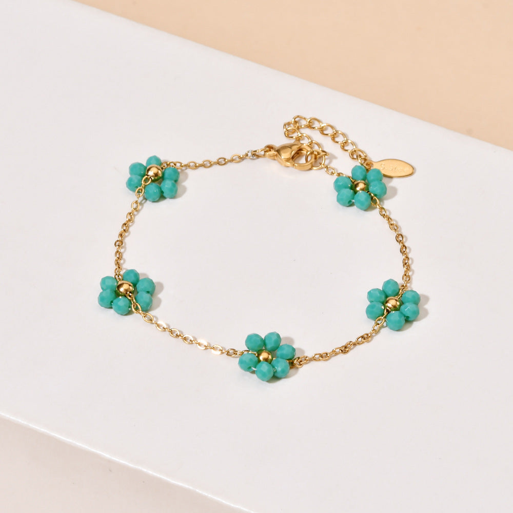Damen zarte Halskette mit floralen Akzenten und goldfarbener Kettengestaltung Shop Nory