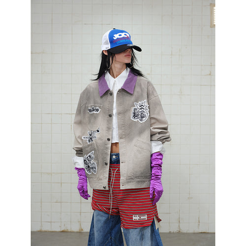 Unisex Kastig geschnittene Chorejacke aus Baumwollcanvas mit artistischen Patch Applikationen und Cordkragen Shop Nory