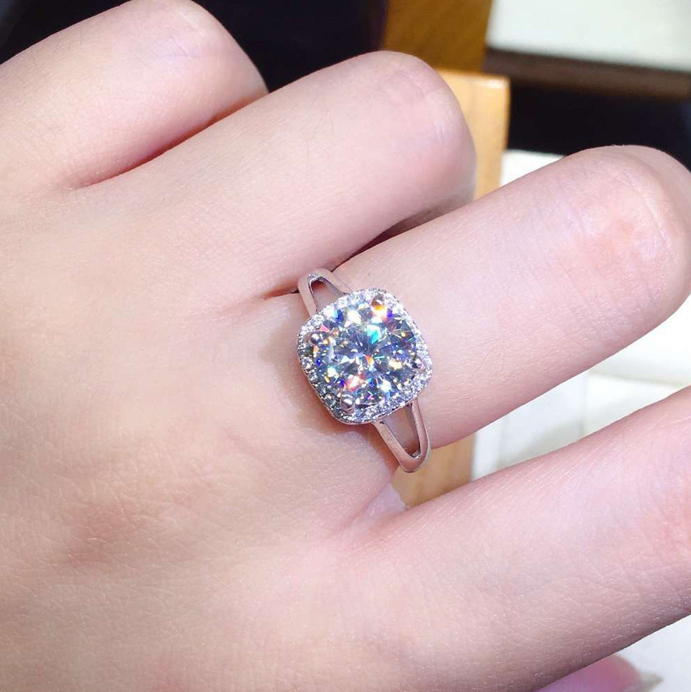 Damen eleganter Schmuckring mit quadratischem Hauptstein und funkelndem Zirkonia-Rahmen Shop Nory